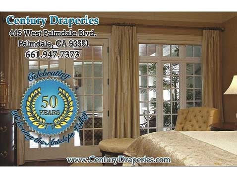 A photo of a well furnished interior with a badge stating "Celebrating 50 Years". Captions state the business address, phone number, and website URL